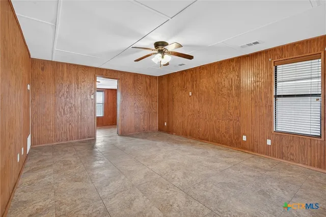 a view of an empty room with a window