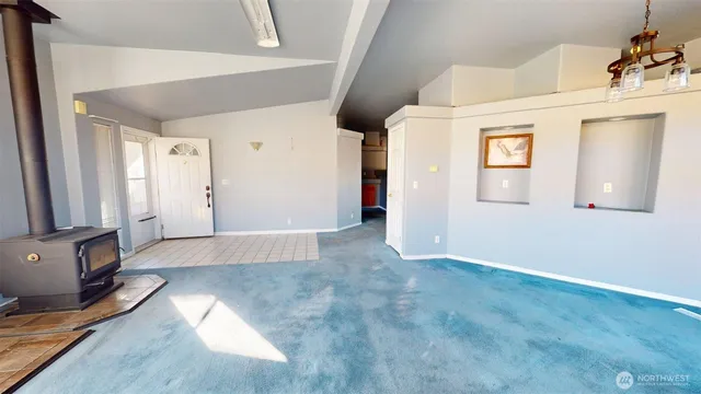 a view of a livingroom with wooden floor and a flat screen tv