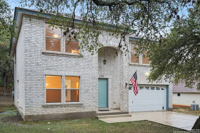 a front view of a house with garage