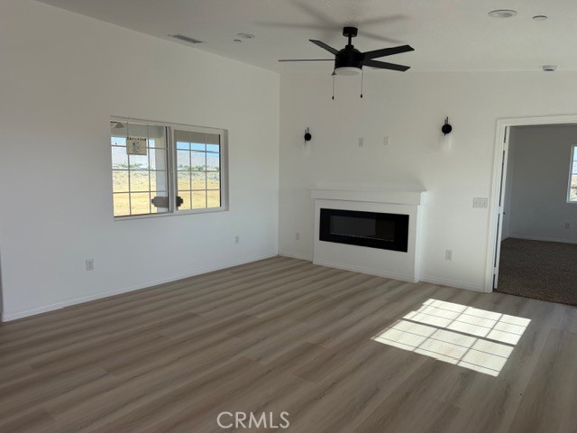 16925 Nanticoke Road Apple Valley, CA 92307 - Photo 3 of 87 a view of empty room with wooden floor and fan