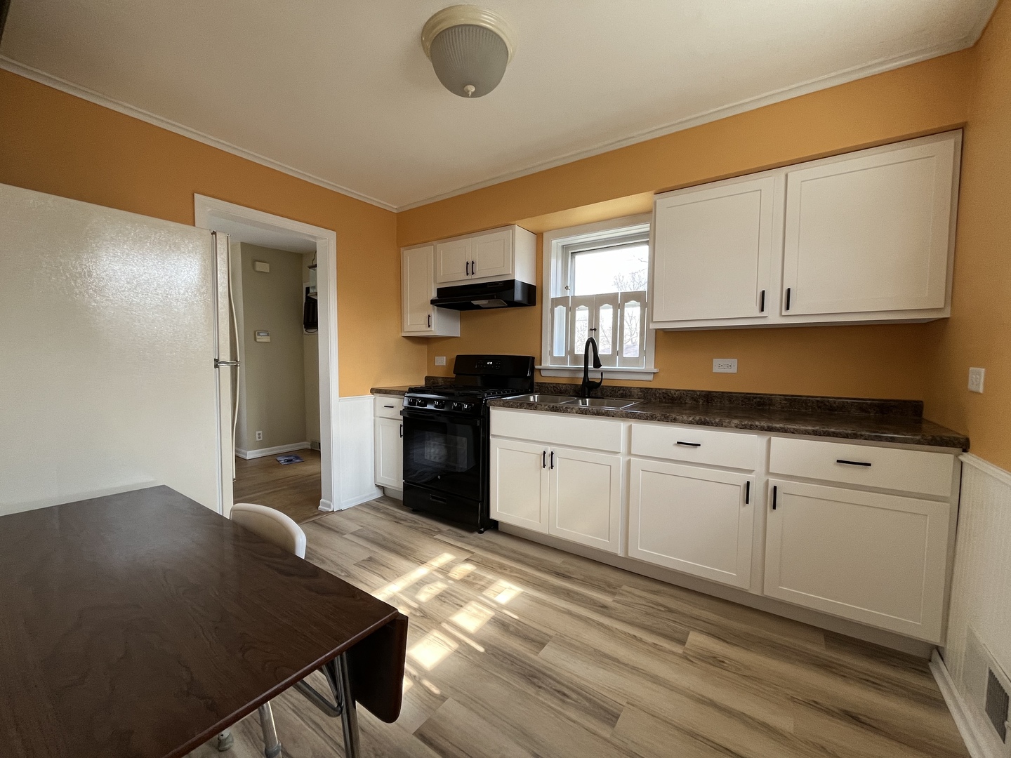 2429 Spruce Road Homewood, IL 60430 - Photo 3 of 18 a kitchen with granite countertop a stove a sink and a refrigerator