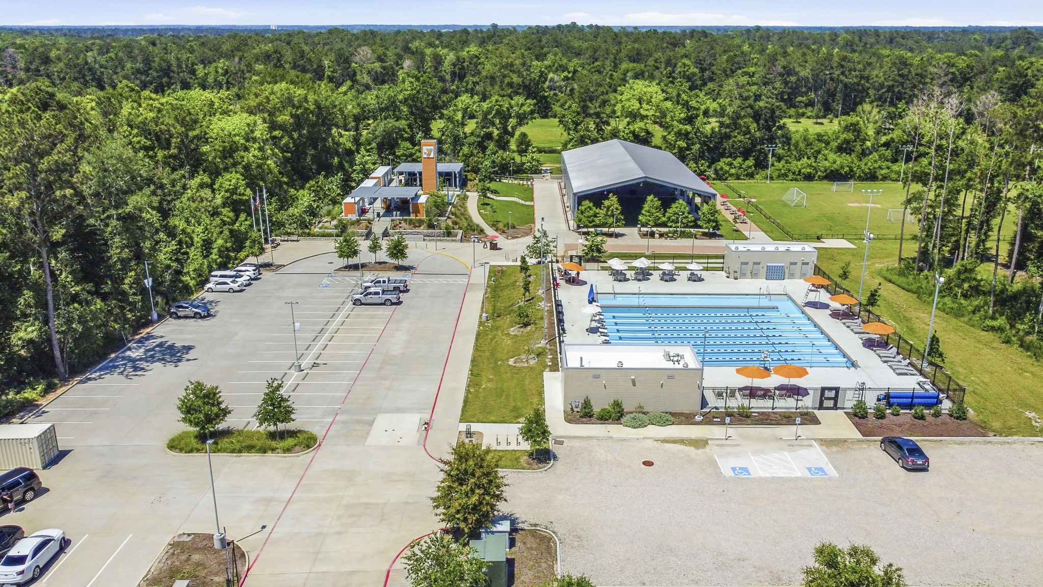 3900 Enchanted Timbers Lane Spring, TX 77386 - Photo 45 of 49 an aerial view of a house with swimming pool patio and lake view