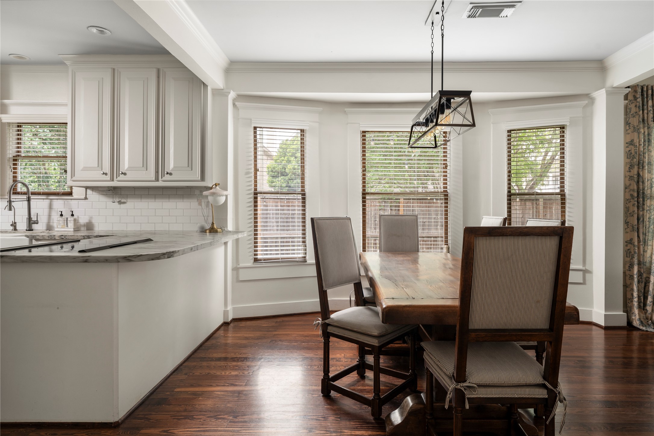 602 Aurora Street Houston, TX 77008 - Photo 11 of 36 Dining and kitchen connection that emphasizes flow and functionality. The open relationship between spaces allows for easy movement and interaction. A layout that works naturally for both daily routines and hosting.