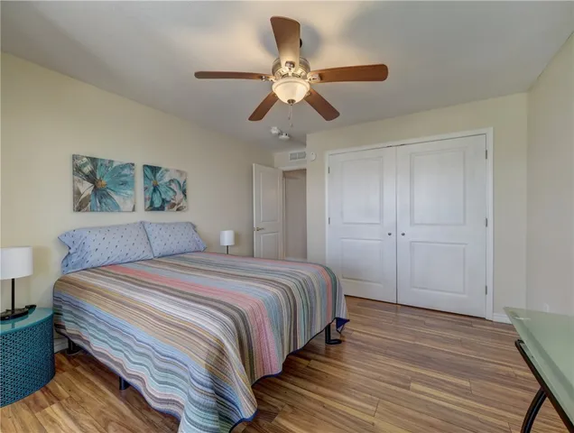 a bedroom with a bed and a table