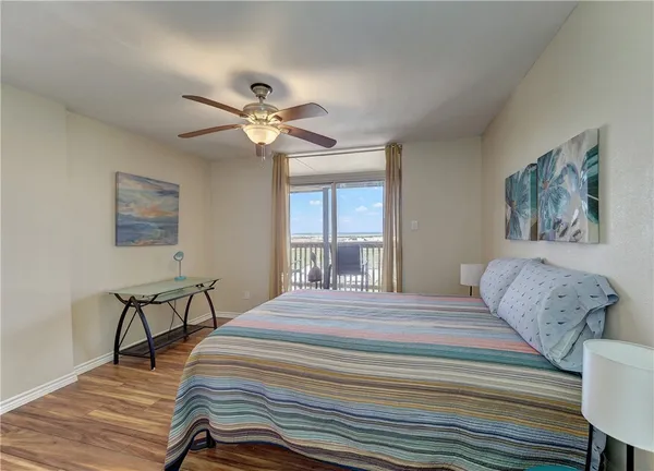 a bedroom with a bed and a table