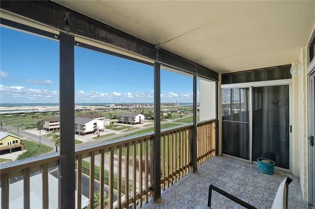 a living room with furniture and a mirror