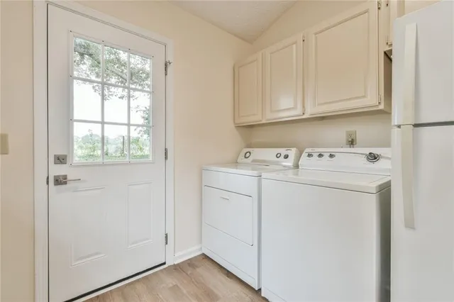 a utility room with dryer and washer