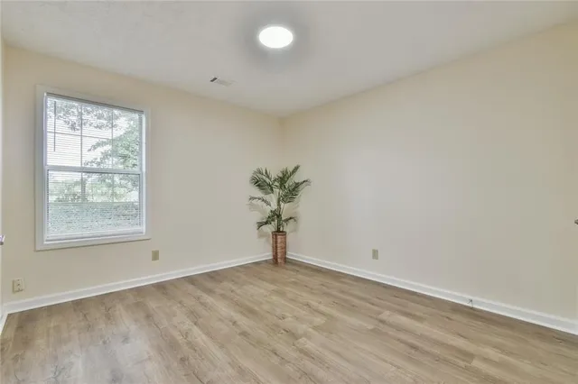 an empty room with a empty space and a window