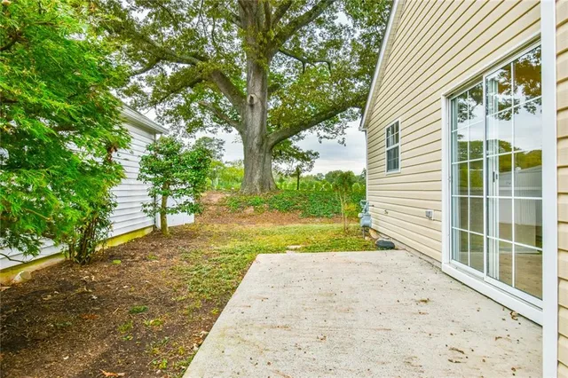 a view of a backyard with large trees