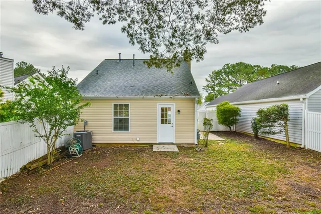 a view of a house with a yard and garage