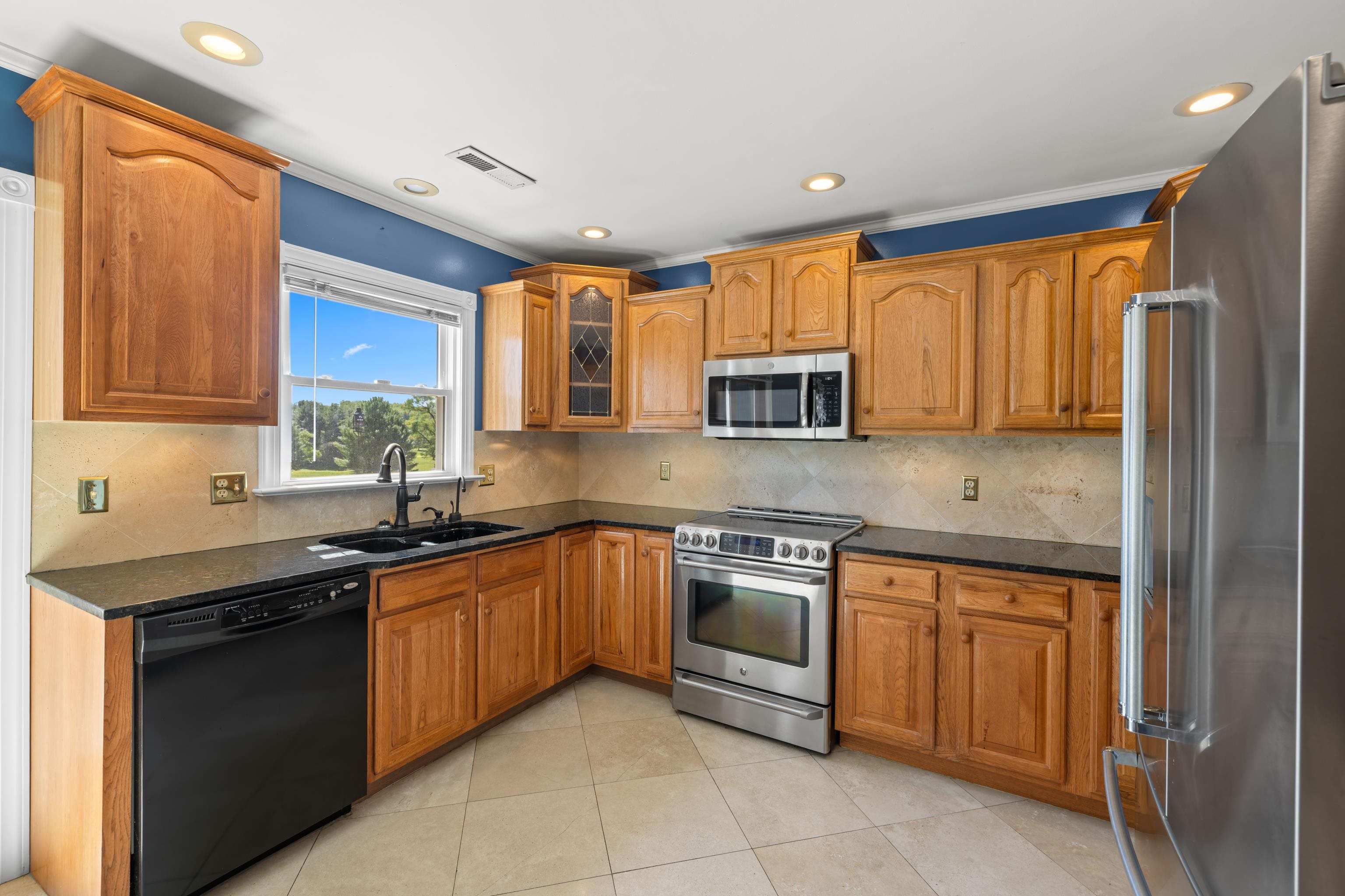 1569 Massanetta Springs Road Harrisonburg, VA 22801 - Photo 24 of 75 a kitchen with stainless steel appliances granite countertop a sink and cabinets