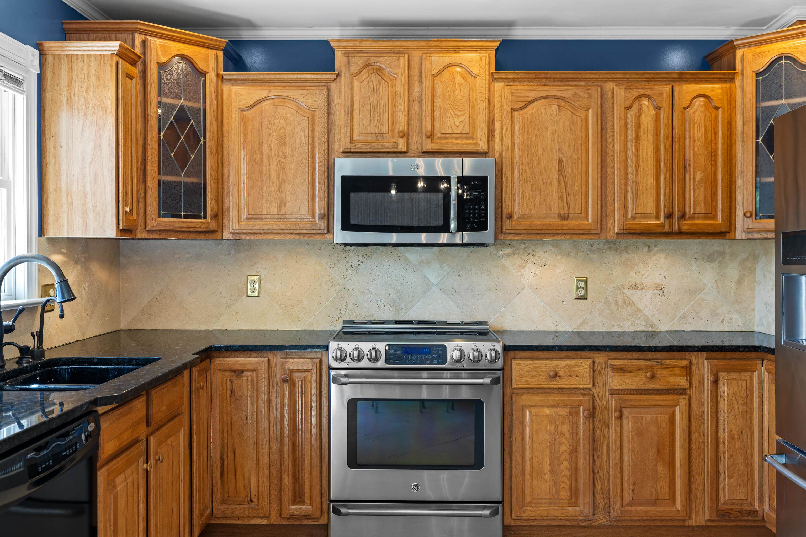 1569 Massanetta Springs Road Harrisonburg, VA 22801 - Photo 28 of 75 a kitchen with stainless steel appliances granite countertop a stove a sink and a microwave
