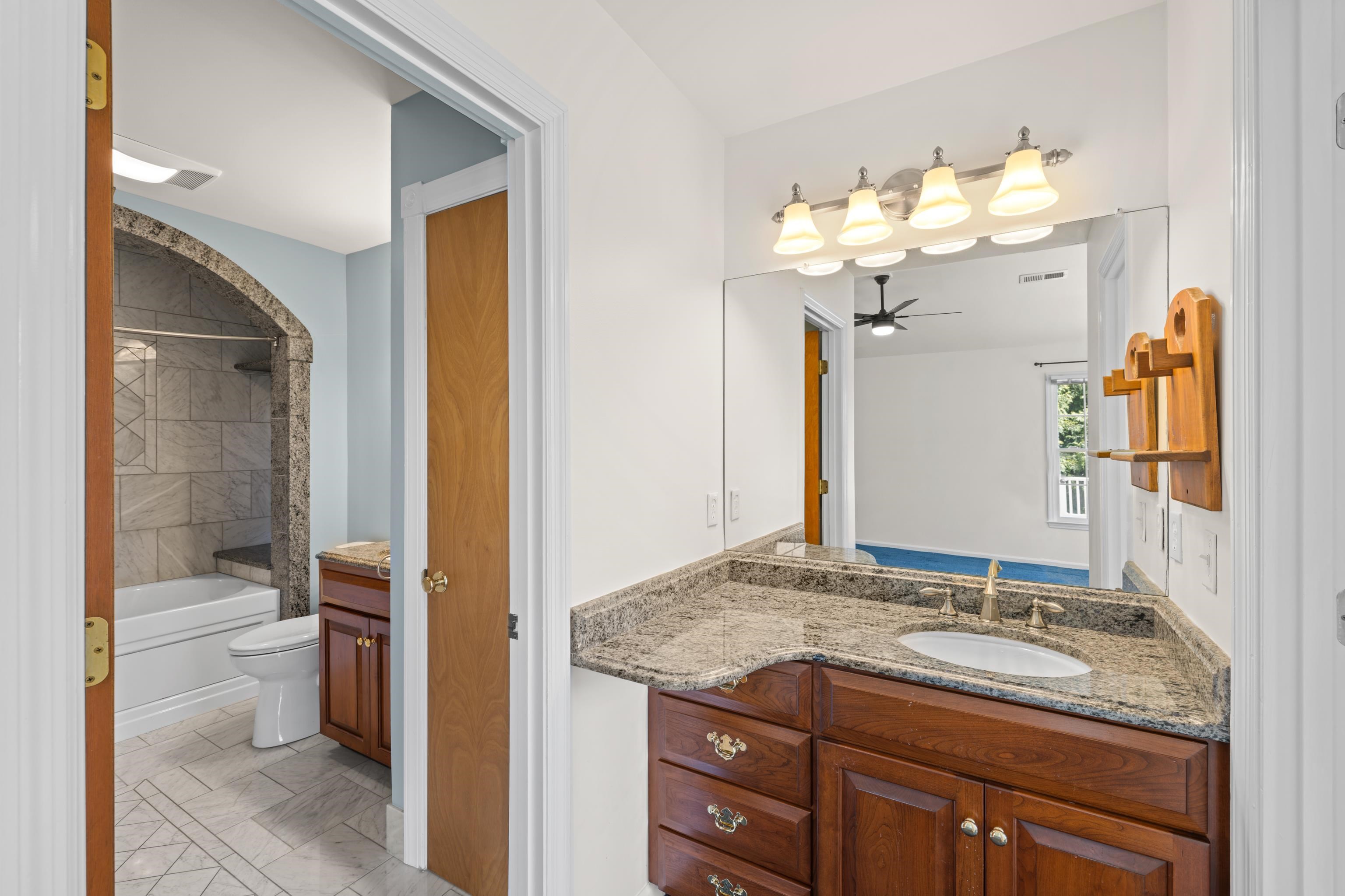 1569 Massanetta Springs Road Harrisonburg, VA 22801 - Photo 41 of 75 a bathroom with a granite countertop sink toilet and shower