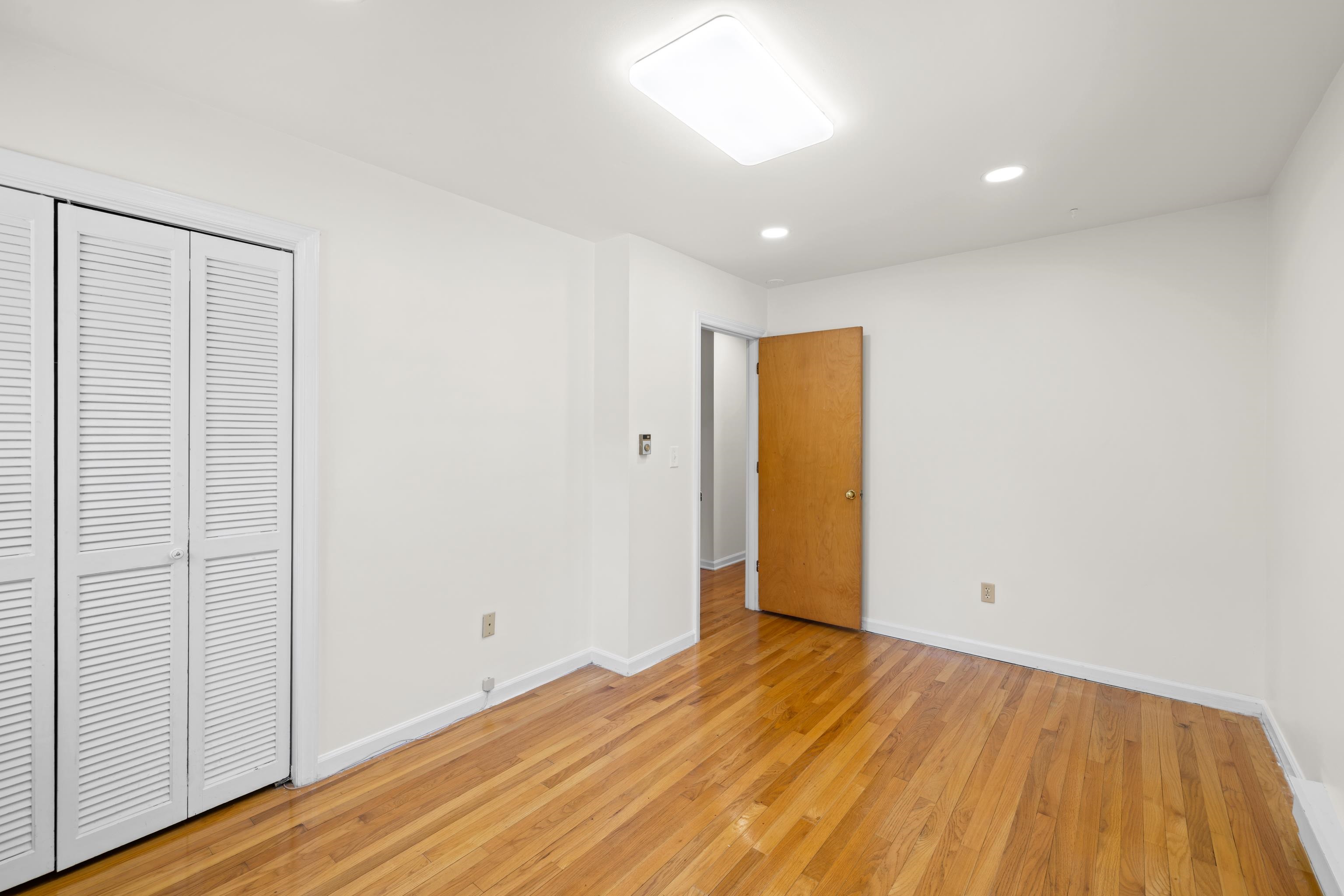 1569 Massanetta Springs Road Harrisonburg, VA 22801 - Photo 45 of 75 a view of an empty room with wooden floor