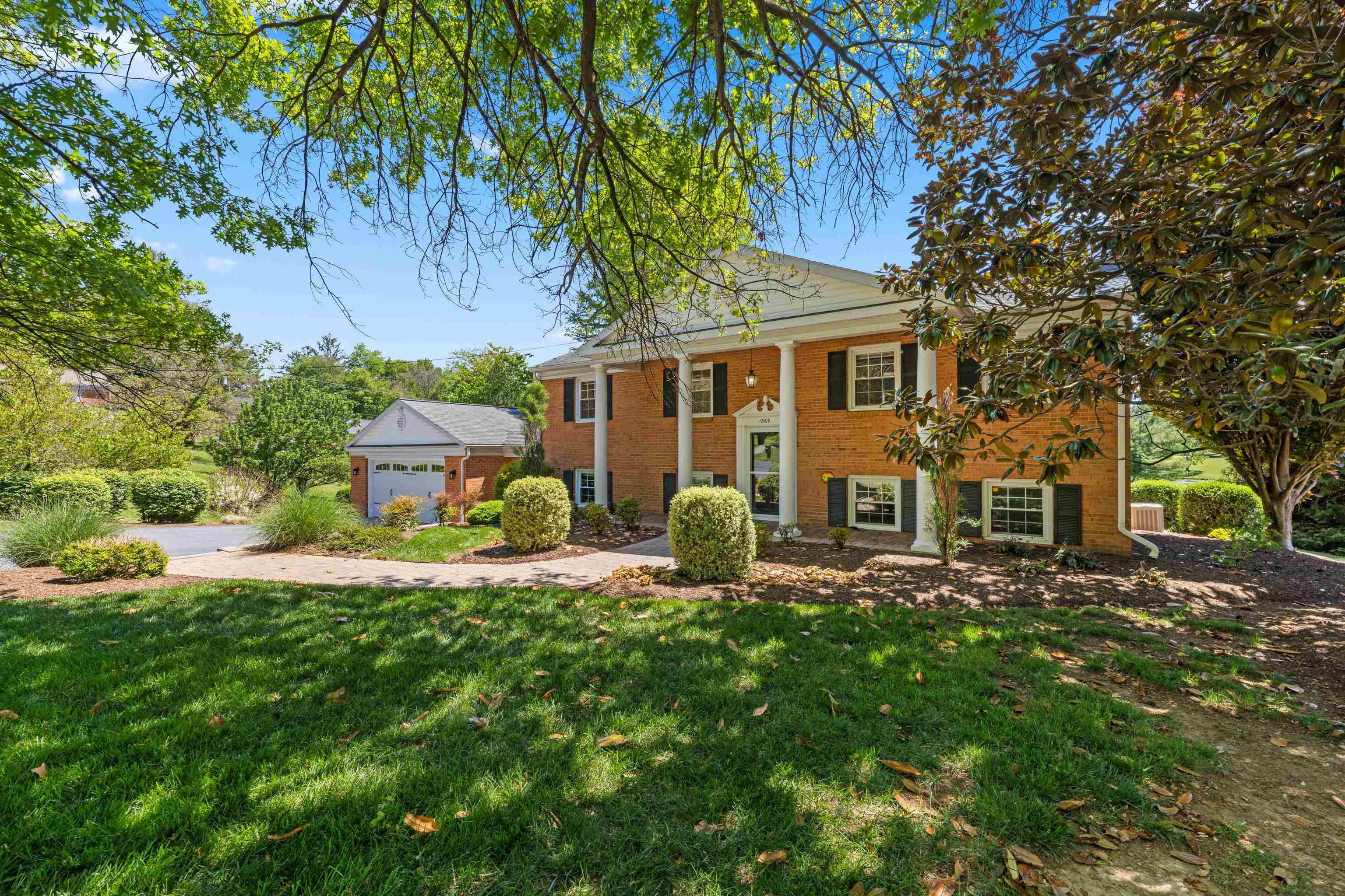 1569 Massanetta Springs Road Harrisonburg, VA 22801 - Photo 5 of 75 a front view of a house with a yard glass tree and outdoor seating