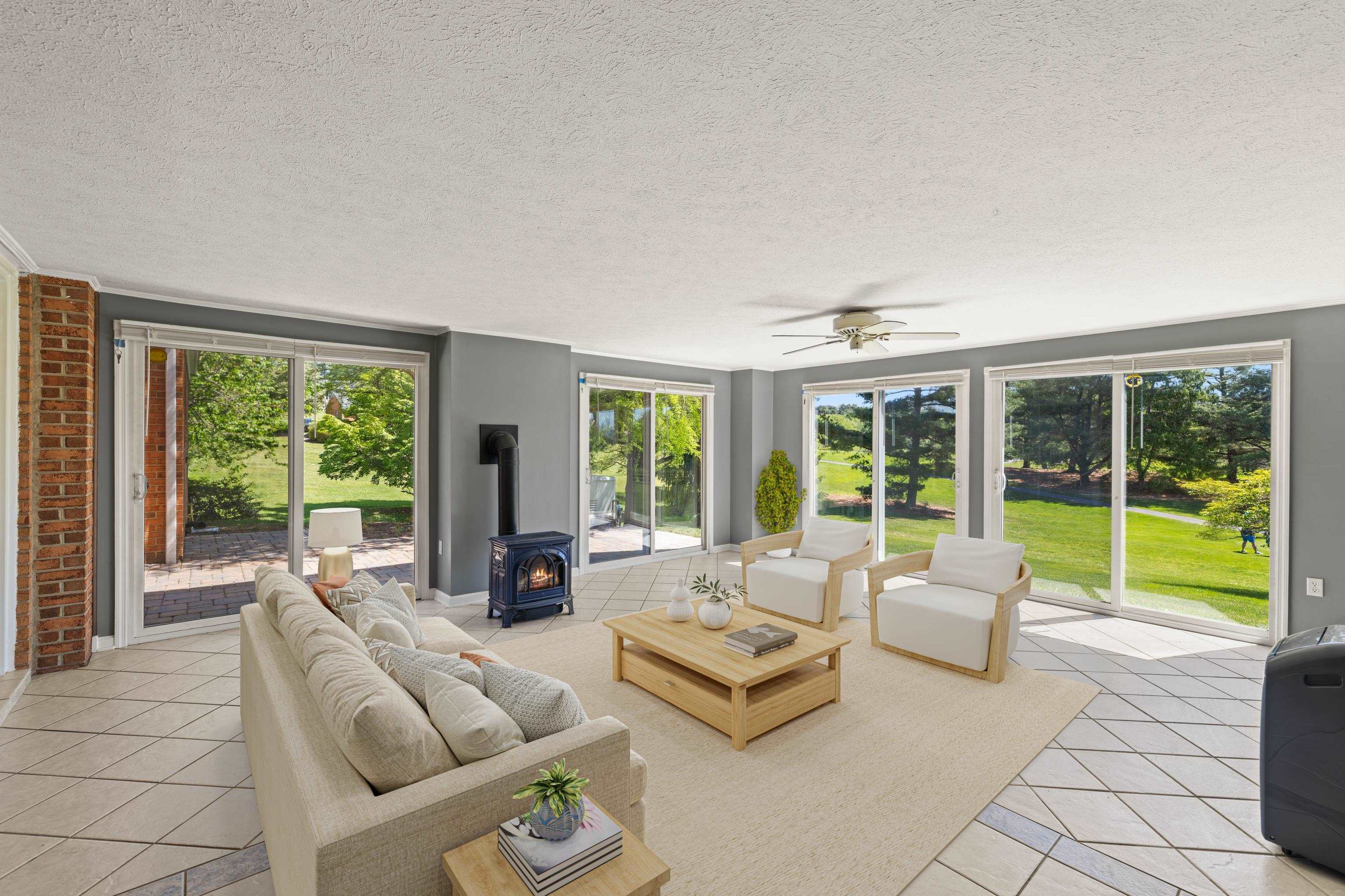 1569 Massanetta Springs Road Harrisonburg, VA 22801 - Photo 58 of 75 a living room with furniture and large windows