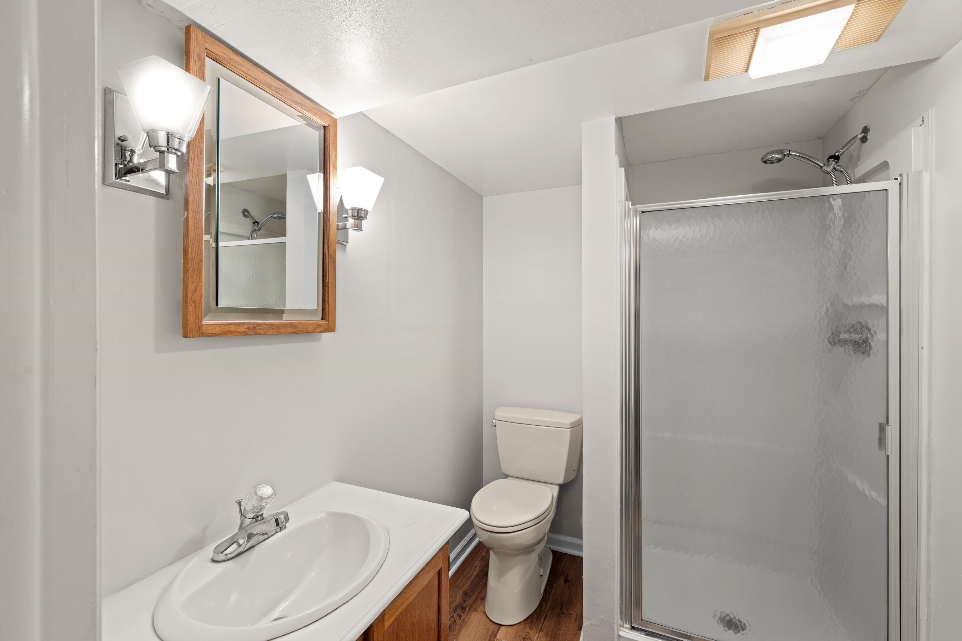 1569 Massanetta Springs Road Harrisonburg, VA 22801 - Photo 60 of 75 a bathroom with a toilet sink and shower