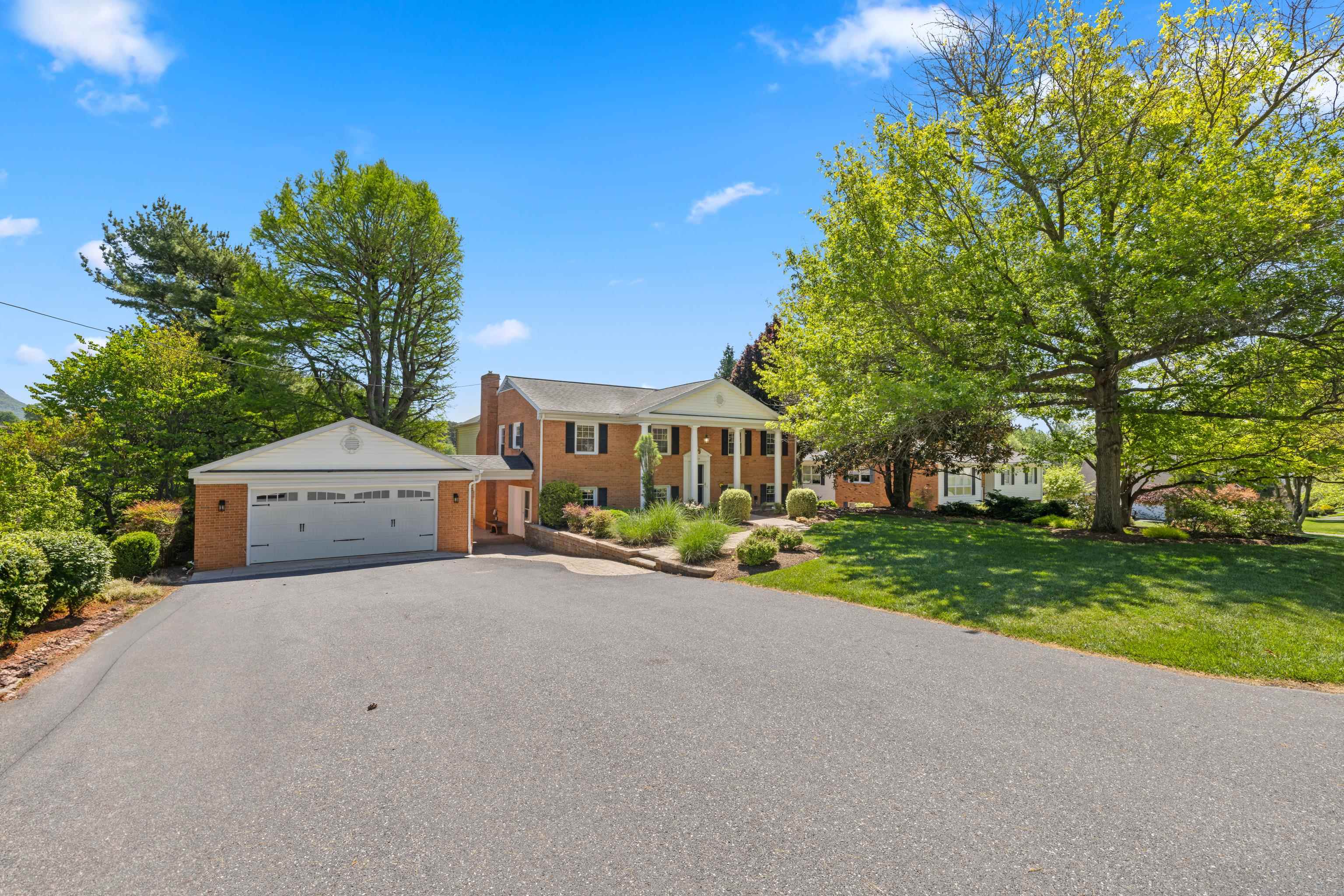 1569 Massanetta Springs Road Harrisonburg, VA 22801 - Photo 6 of 75 a front view of a house with a yard and garage