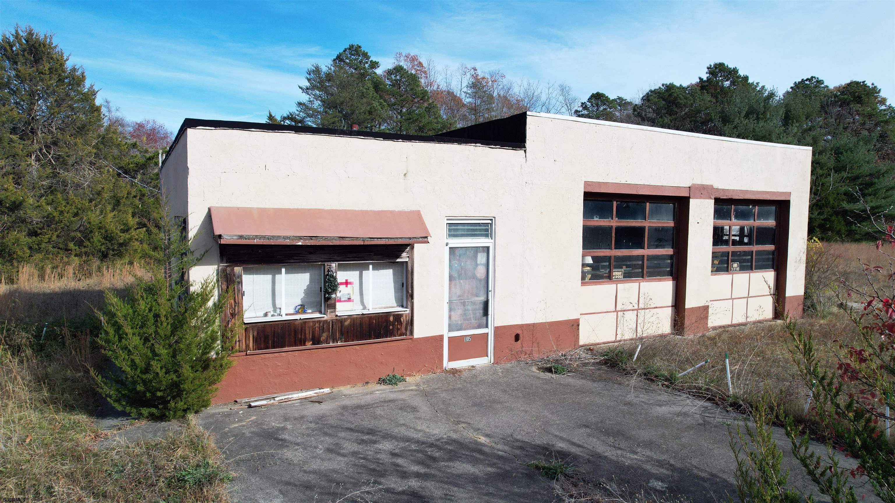 1105 Tuckahoe Road Milmay, NJ 08340 - Photo 19 of 20 a front view of a house with a yard and garage