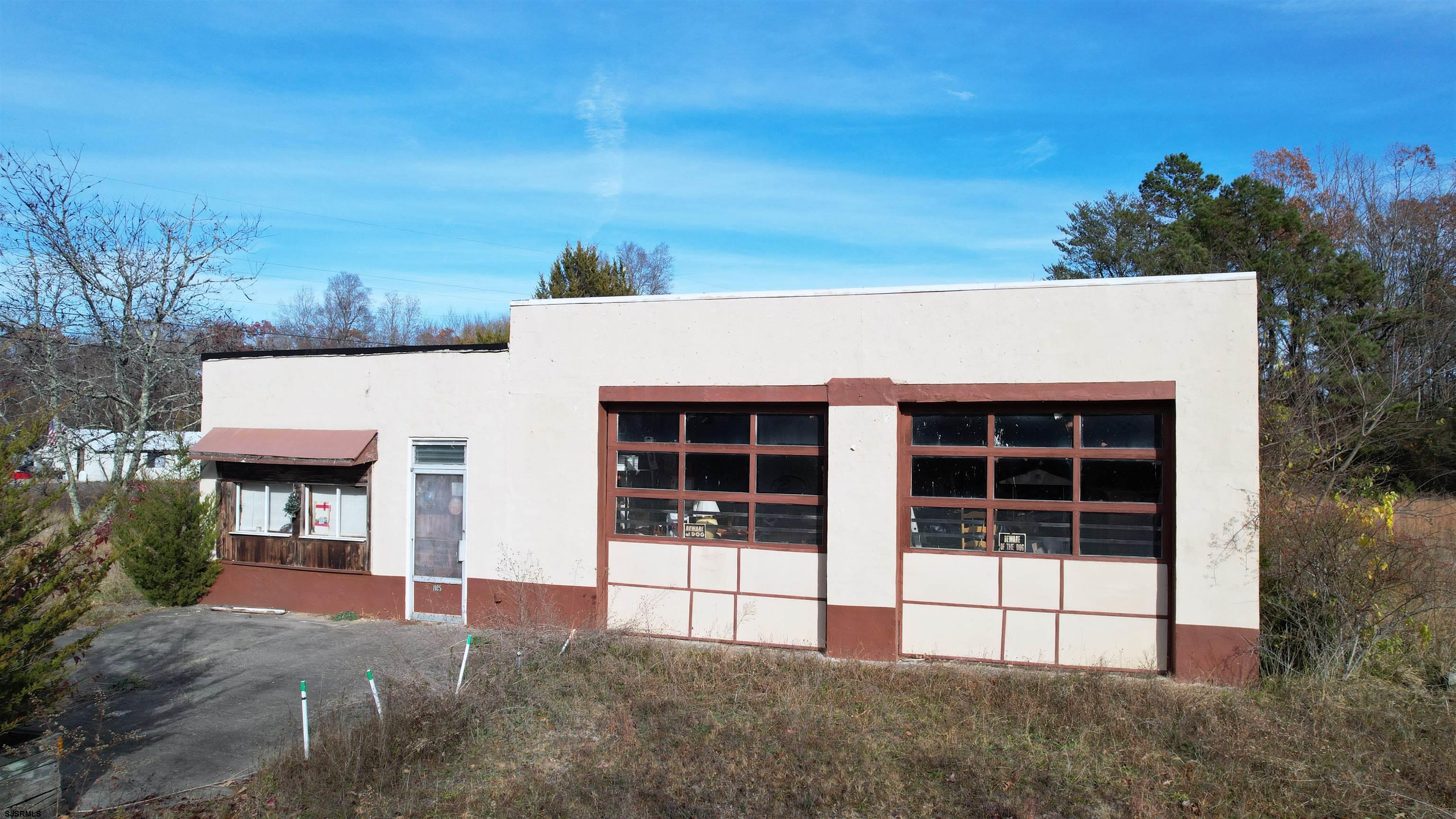 1105 Tuckahoe Road Milmay, NJ 08340 - Photo 20 of 20 a view of a house with a yard and potted plants