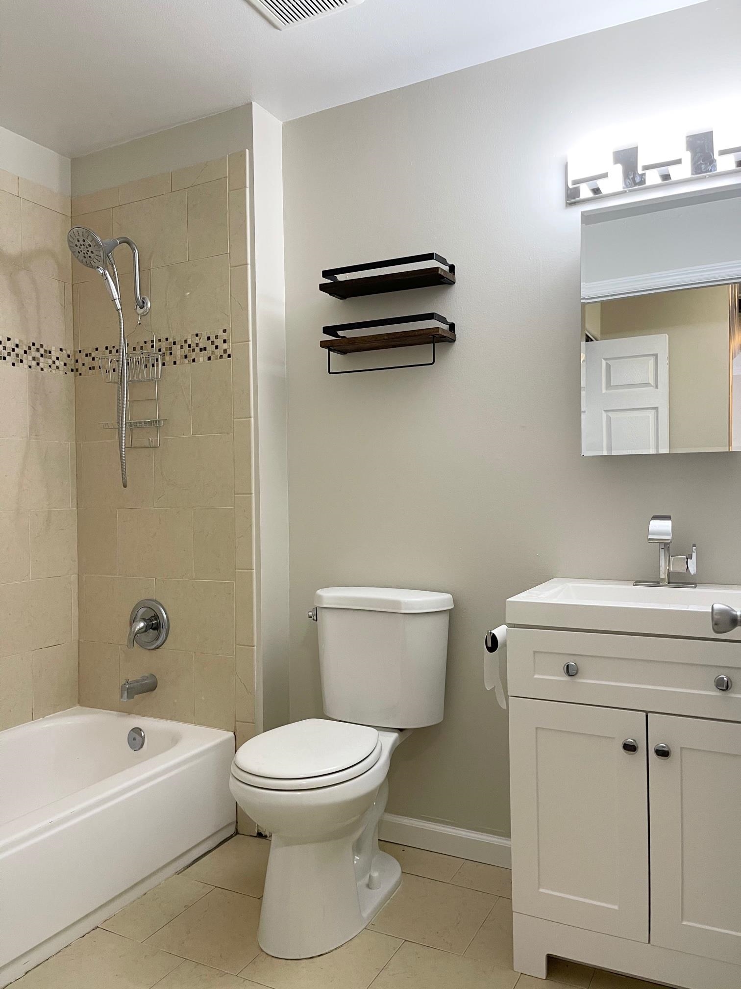 26 Bergen Ridge Road, Unit 2 North Bergen, NJ 07047 - Photo 6 of 9 a bathroom with a sink a toilet and shower
