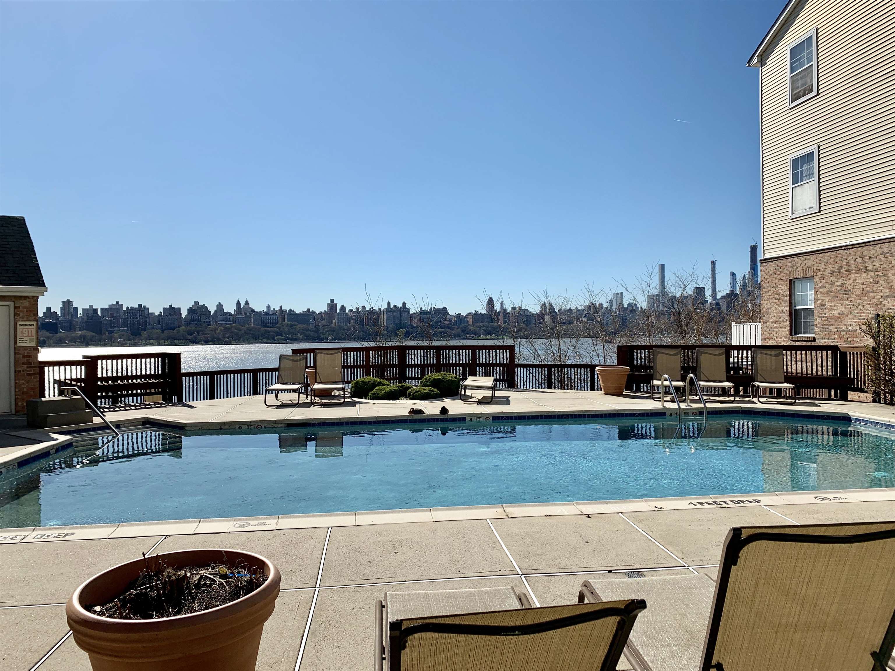 26 Bergen Ridge Road, Unit 2 North Bergen, NJ 07047 - Photo 8 of 9 a view of a swimming pool with lawn chairs and a yard