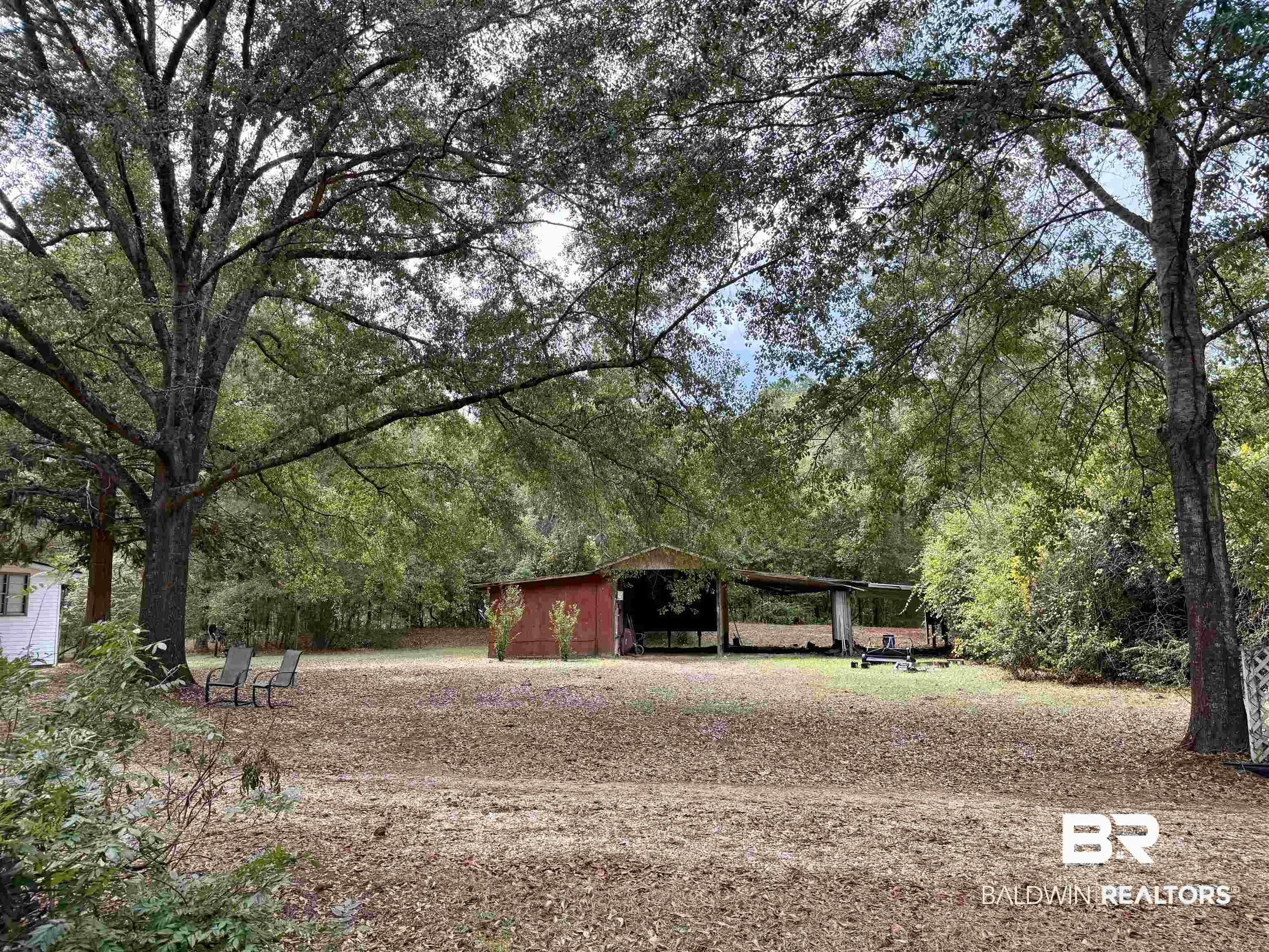 826 West Side Road Castleberry, AL 36432 - Photo 31 of 34 View of property's community featuring a carport and an outdoor structure