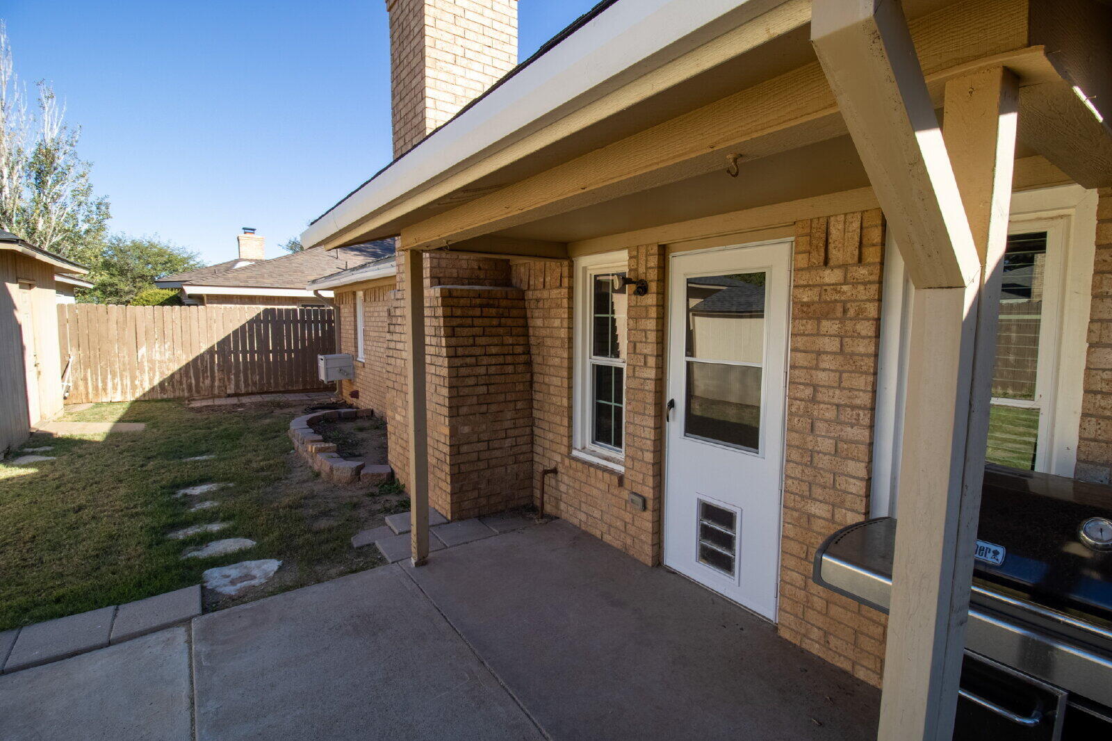 5718 90th Street Lubbock, TX 79424 - Photo 14 of 15 a view of a house with backyard and porch