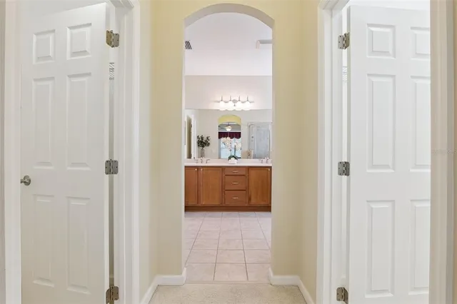 a bathroom with a tub and a mirror