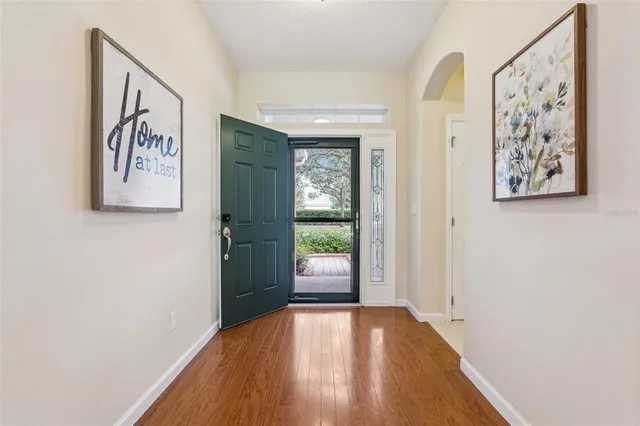 a view of an entryway with wooden floor
