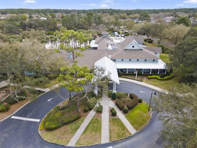 an aerial view of a house with a swimming pool