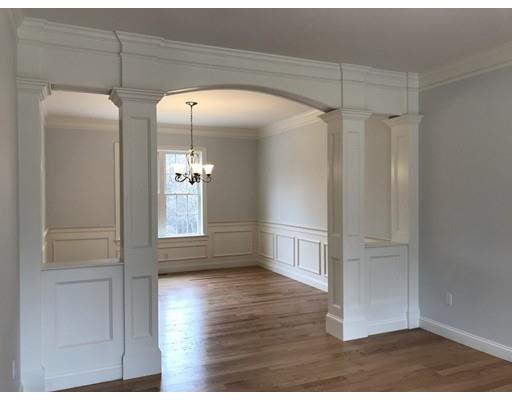 53 Wellesley Rd Extension Natick, MA 01760 - Photo 13 of 33 a view of a hallway with wooden floor and staircase