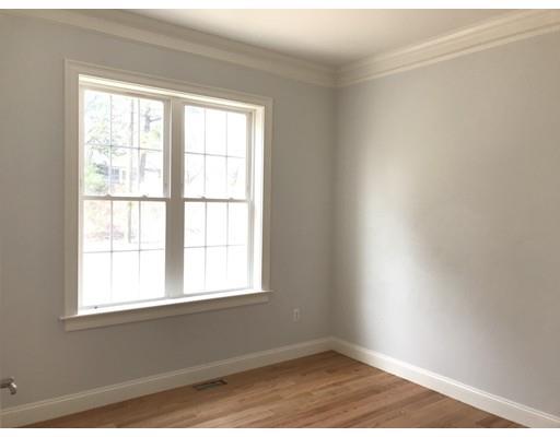 53 Wellesley Rd Extension Natick, MA 01760 - Photo 16 of 33 a view of an empty room with wooden floor and a window