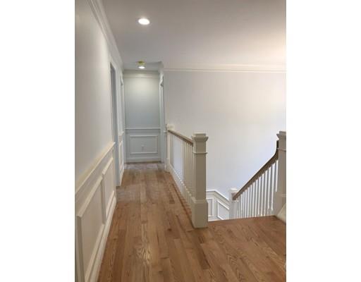 53 Wellesley Rd Extension Natick, MA 01760 - Photo 19 of 33 a view of a hallway with wooden floor