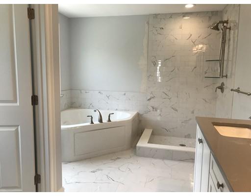 53 Wellesley Rd Extension Natick, MA 01760 - Photo 22 of 33 a bathroom with a bathtub and shower