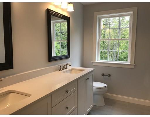 53 Wellesley Rd Extension Natick, MA 01760 - Photo 25 of 33 a bathroom with a granite countertop sink toilet a large mirror and a window