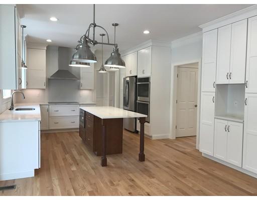 53 Wellesley Rd Extension Natick, MA 01760 - Photo 4 of 33 a kitchen with a refrigerator sink and cabinets