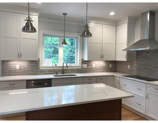 53 Wellesley Rd Extension Natick, MA 01760 - Photo 6 of 33 a kitchen with stainless steel appliances granite countertop a sink a stove and a granite counter tops