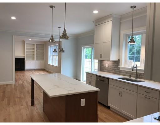 53 Wellesley Rd Extension Natick, MA 01760 - Photo 7 of 33 a kitchen with a sink a center island and wooden floor