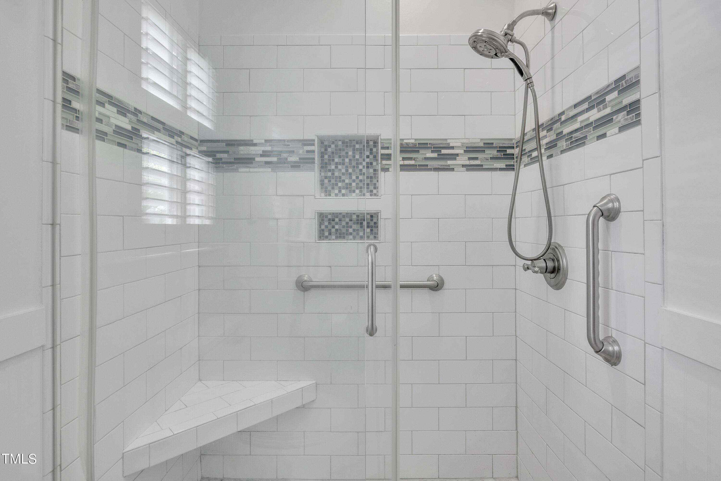 8500 Caldbeck Drive Raleigh, NC 27615 - Photo 13 of 37 a bathroom with a shower