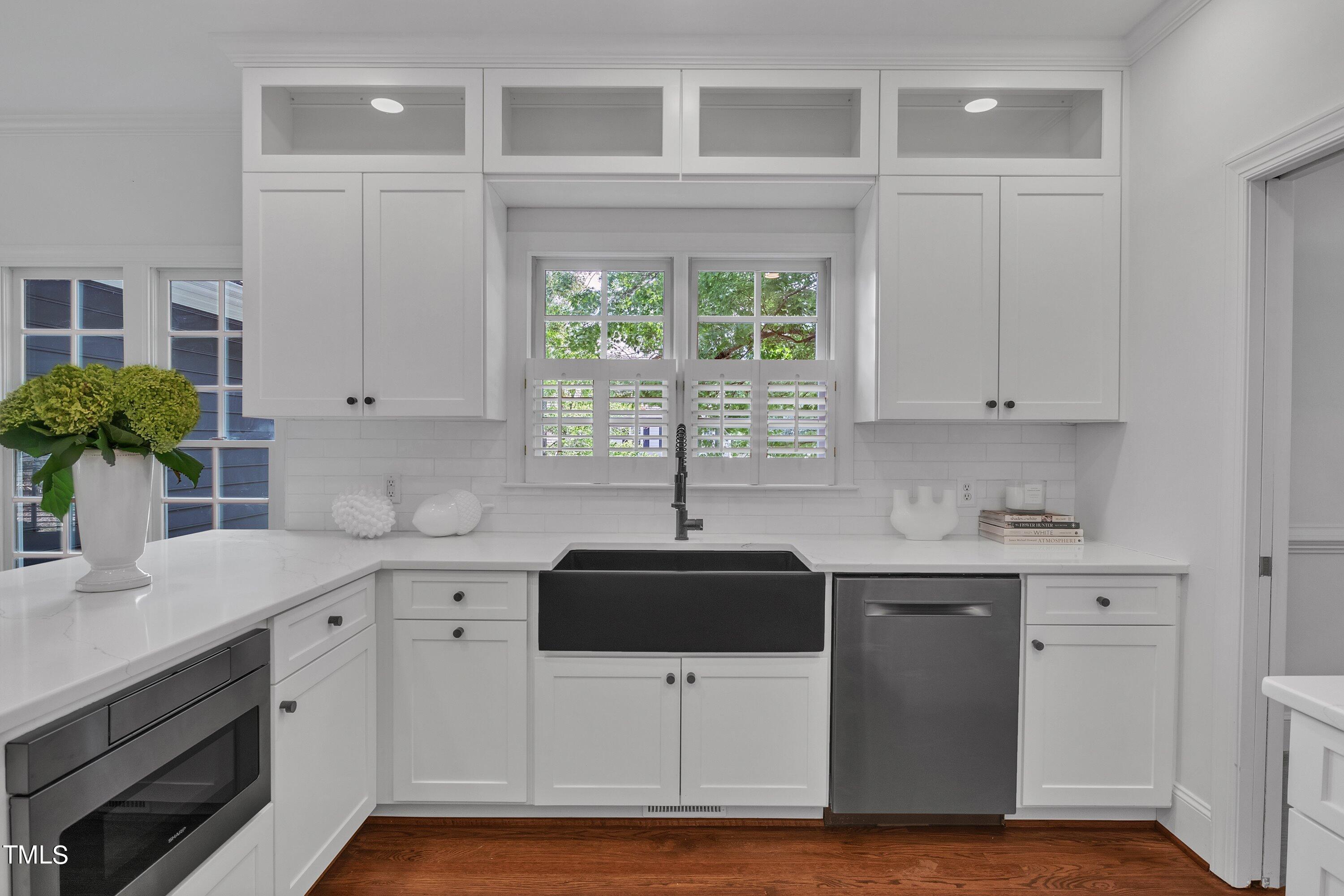 8500 Caldbeck Drive Raleigh, NC 27615 - Photo 17 of 37 a kitchen with a sink and cabinets