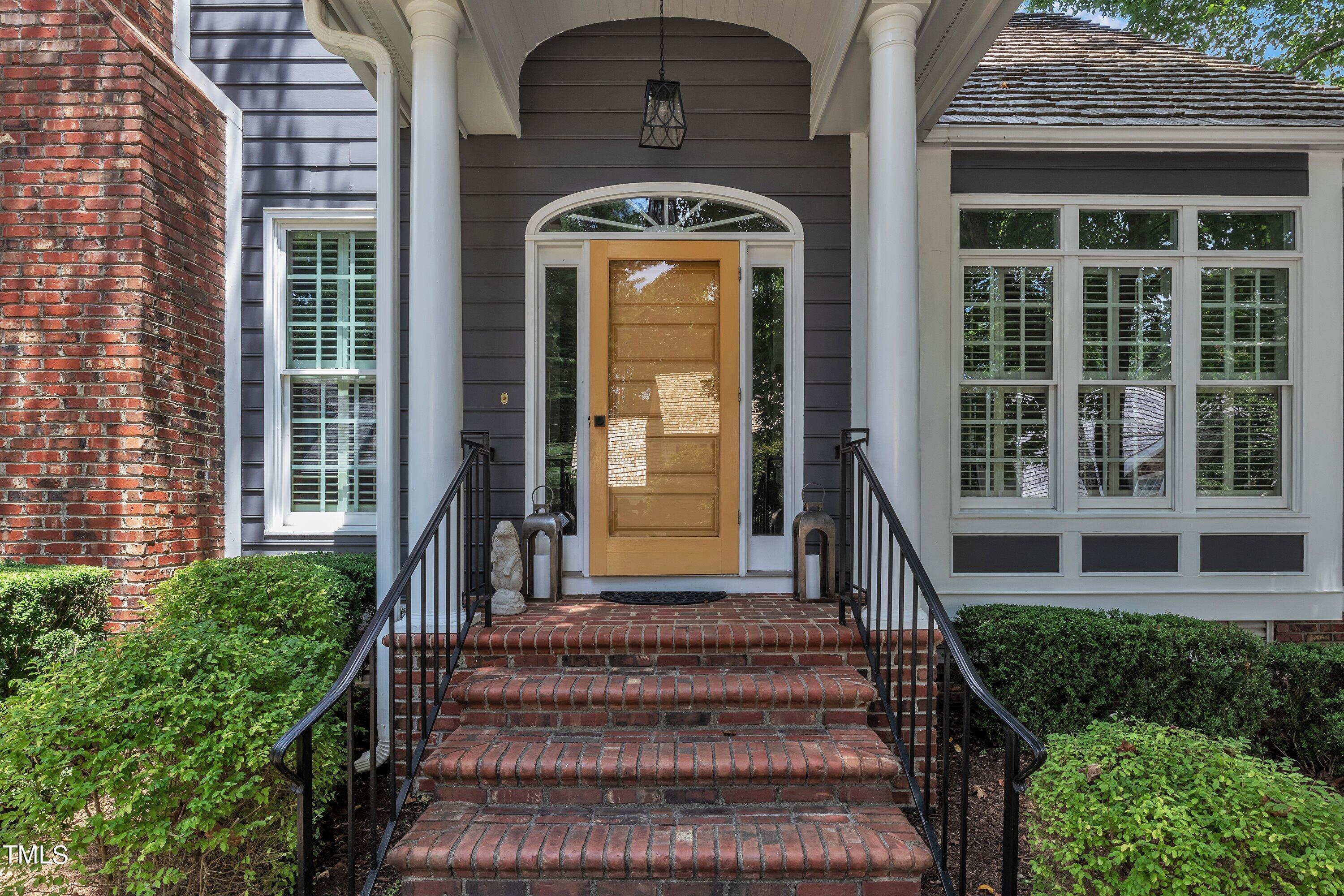 8500 Caldbeck Drive Raleigh, NC 27615 - Photo 2 of 37 a front view of a house with a yard