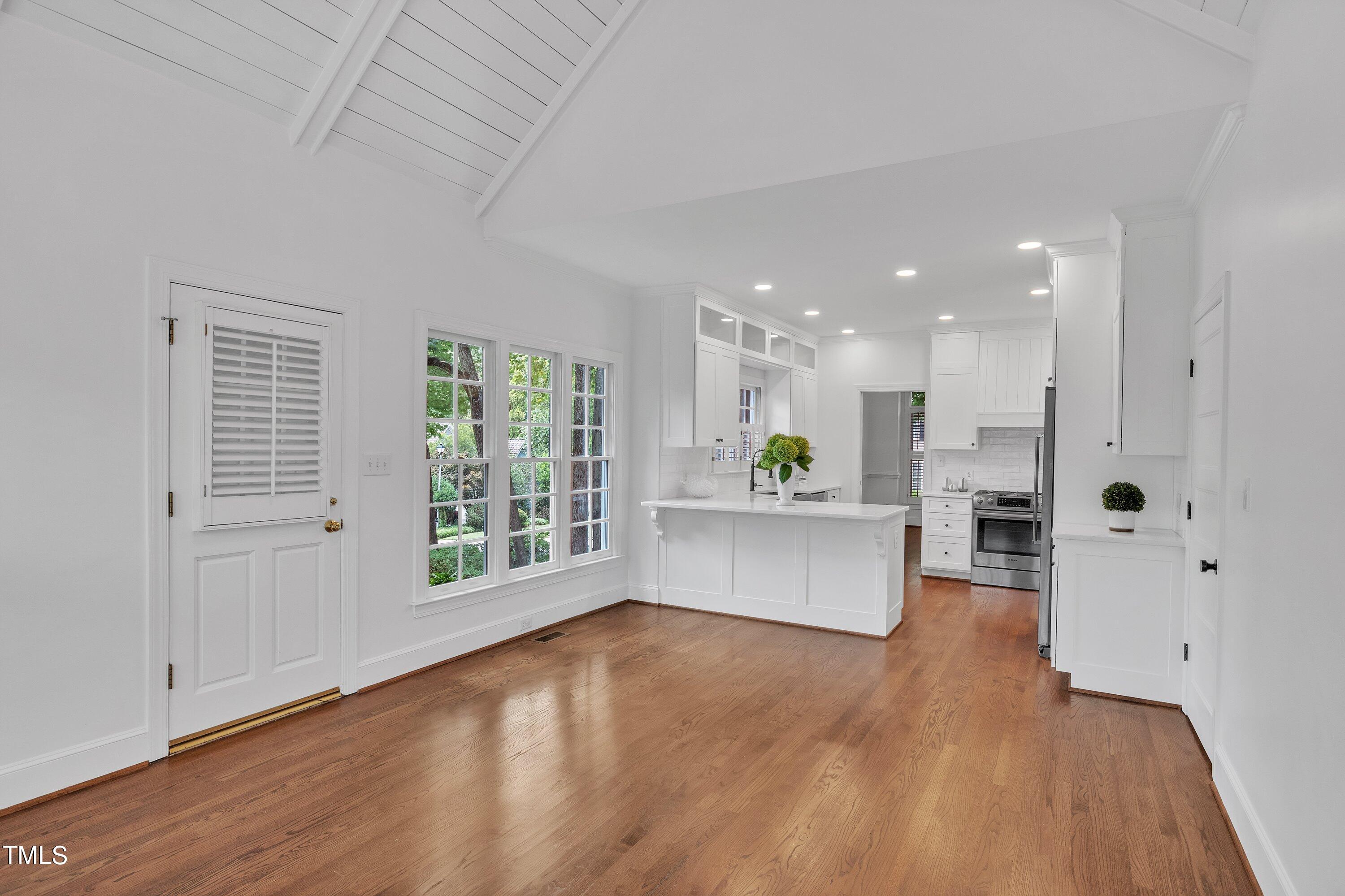 8500 Caldbeck Drive Raleigh, NC 27615 - Photo 22 of 37 a large kitchen with a large window and stainless steel appliances
