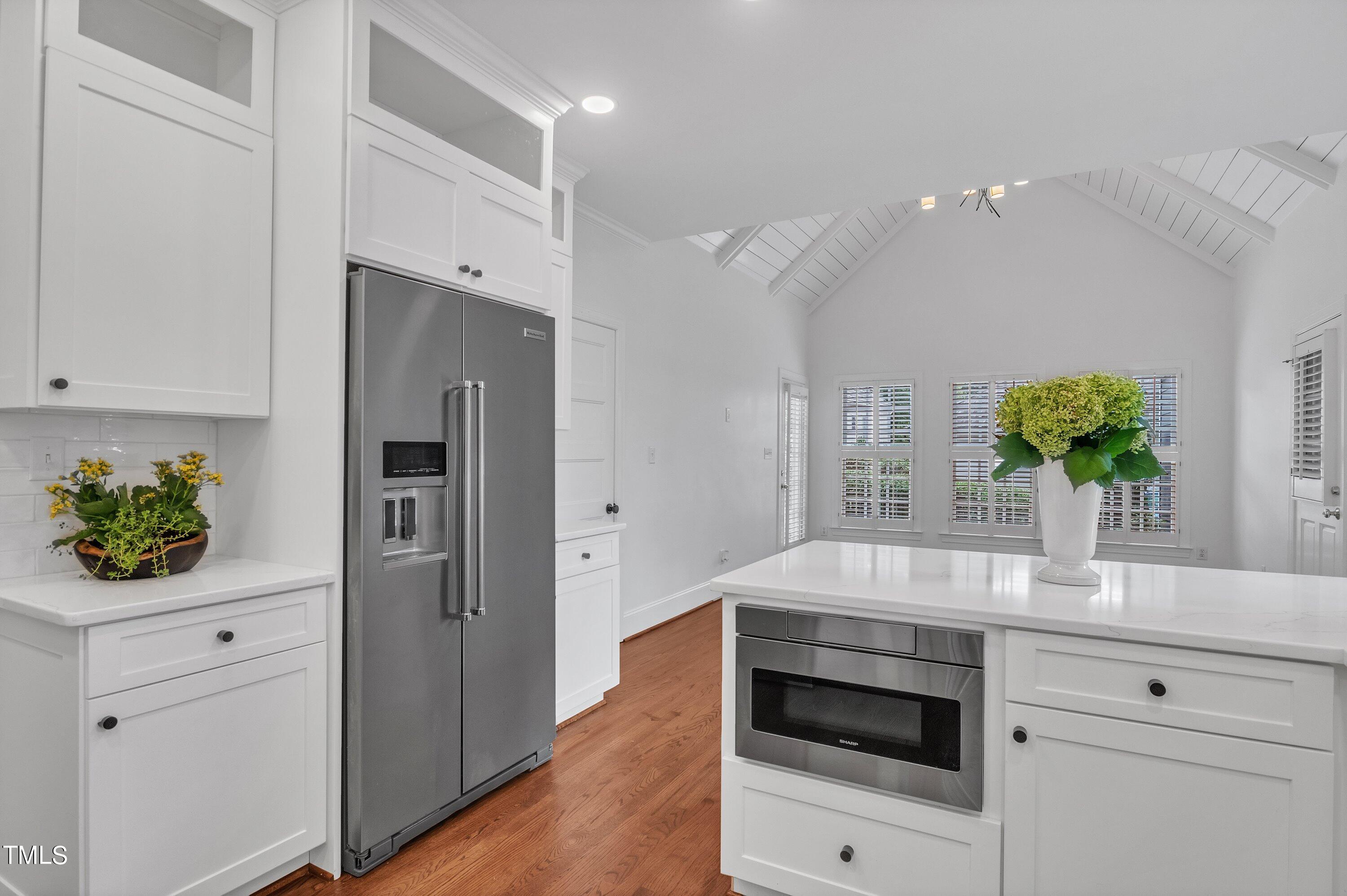 8500 Caldbeck Drive Raleigh, NC 27615 - Photo 24 of 37 a kitchen with a sink and a stove top oven