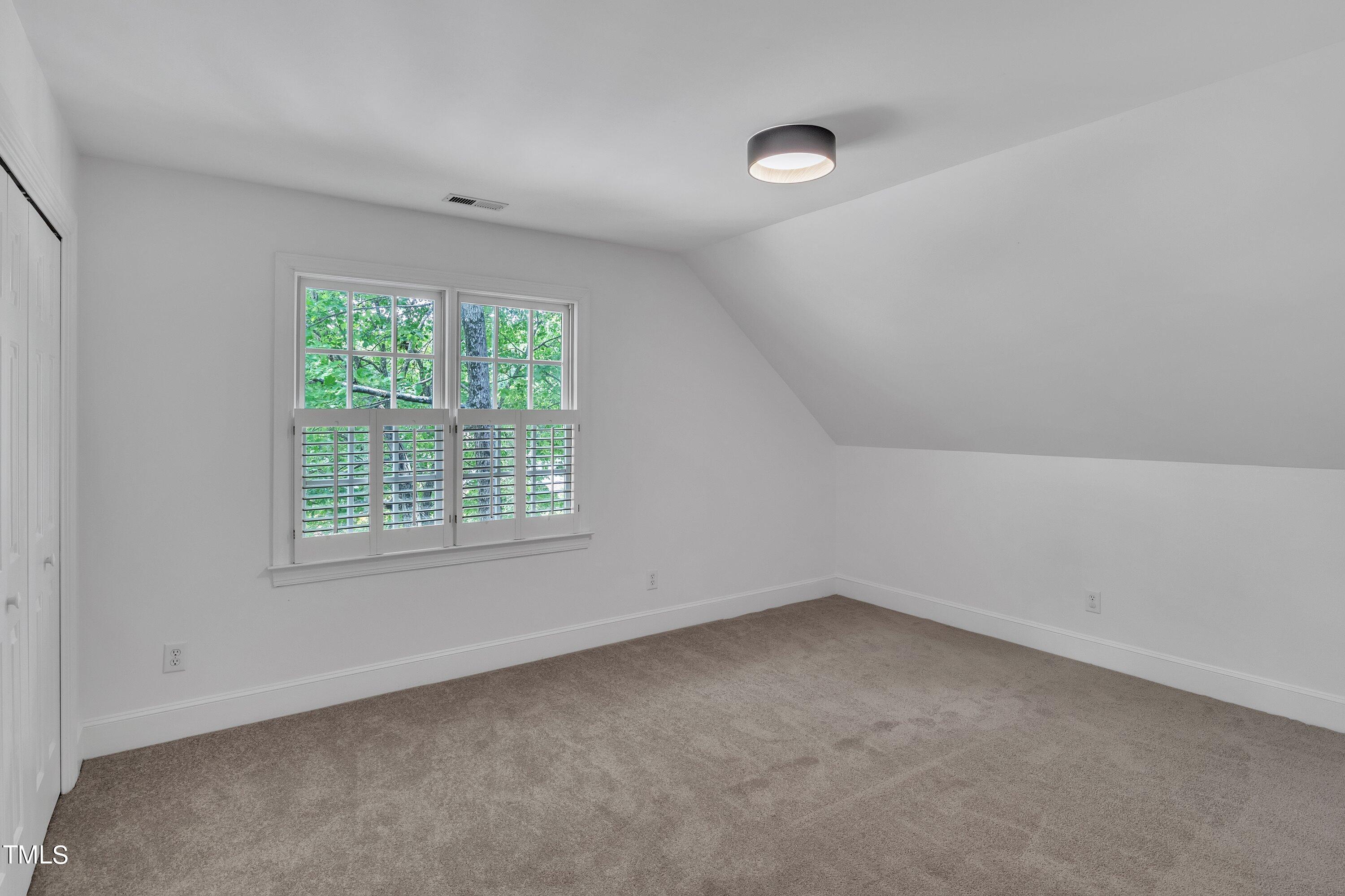 8500 Caldbeck Drive Raleigh, NC 27615 - Photo 25 of 37 an empty room with a window