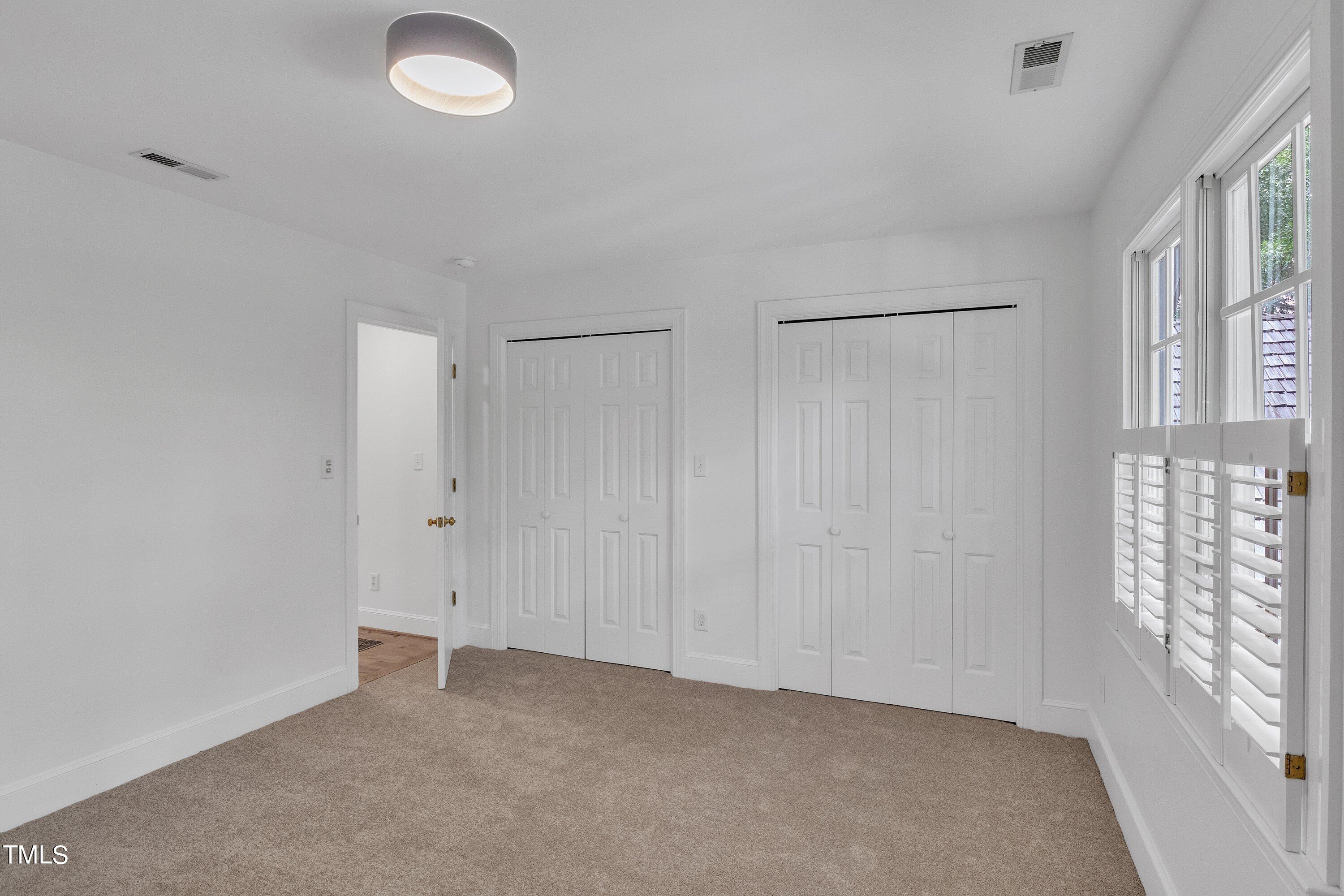 8500 Caldbeck Drive Raleigh, NC 27615 - Photo 26 of 37 a view of an empty room with a window