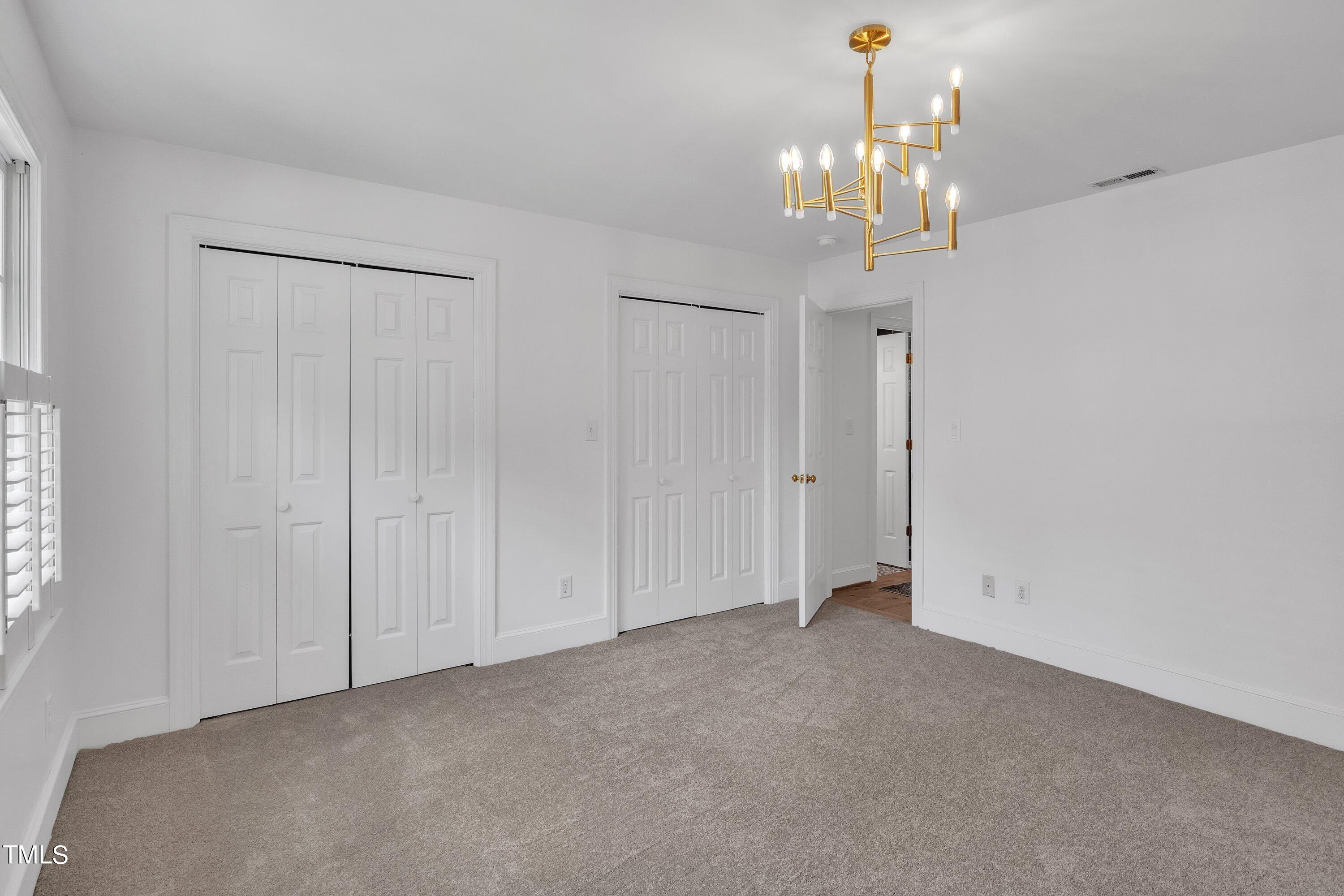 8500 Caldbeck Drive Raleigh, NC 27615 - Photo 31 of 37 a view of a chandelier in big room and chandelier