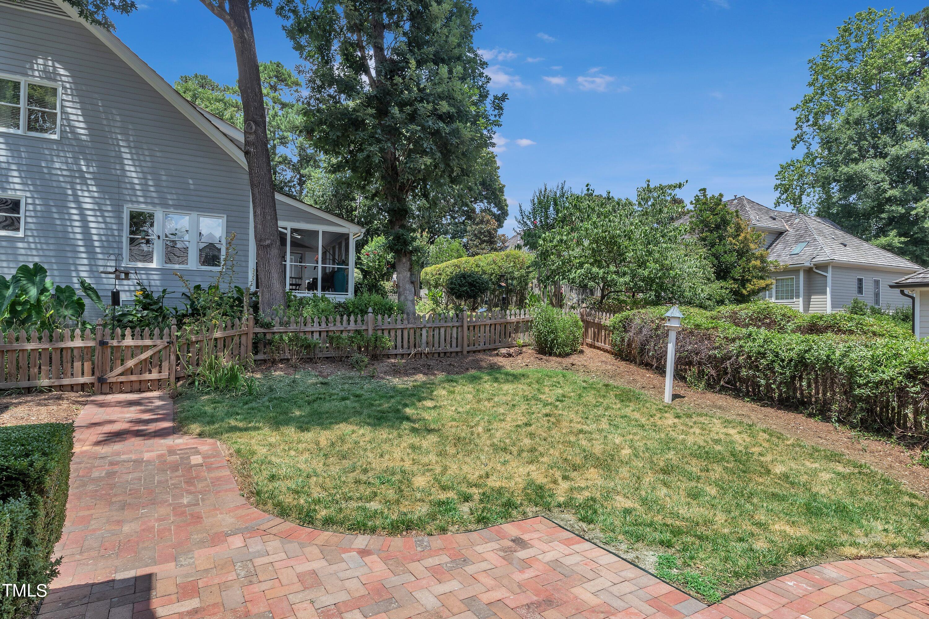 8500 Caldbeck Drive Raleigh, NC 27615 - Photo 32 of 37 a backyard of a house with lots of green space