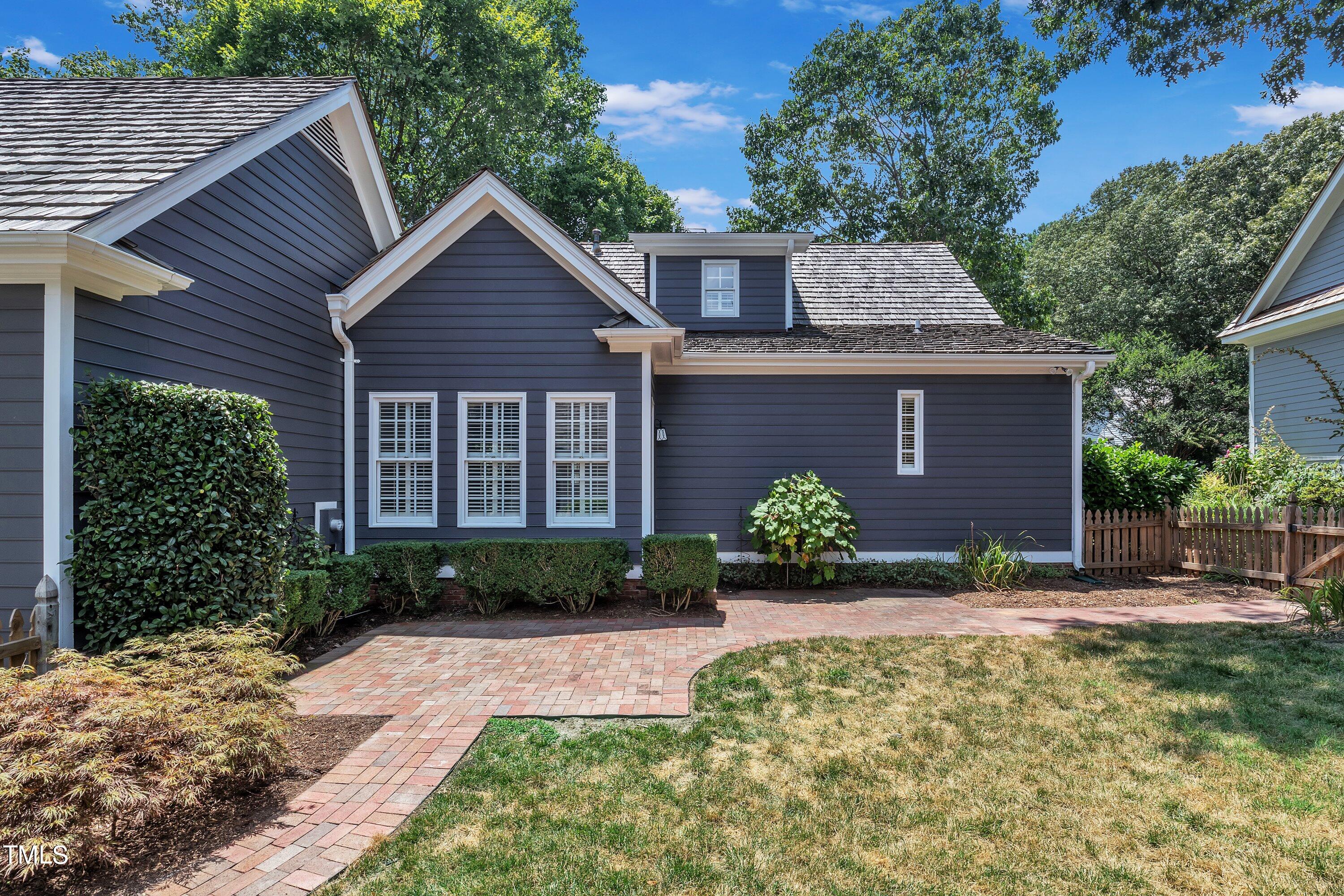 8500 Caldbeck Drive Raleigh, NC 27615 - Photo 35 of 37 a front view of a house with garden