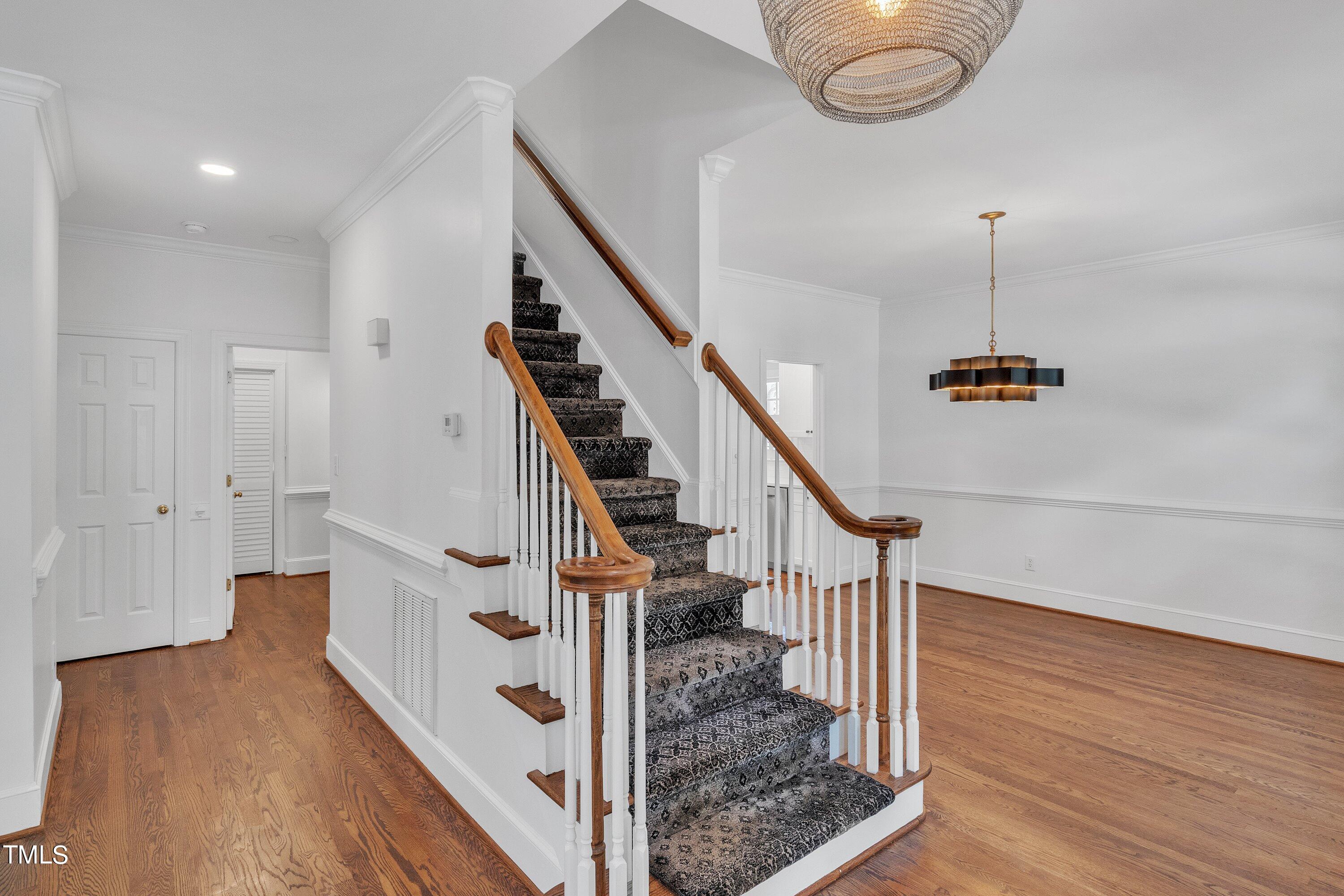 8500 Caldbeck Drive Raleigh, NC 27615 - Photo 4 of 37 a view of entryway and hall with wooden floor